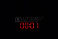 48512107-00-01-electronic-time-clock-with-red-illumination-on-black-background.jpg