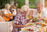 63932528-shot-of-a-group-of-elderly-people-having-a-dinner-party.jpg