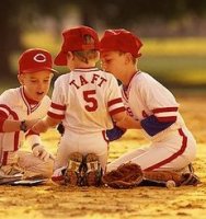 700-00077926em-three-boys-in-baseball-uniforms-playing-with-trading-cards-outdoors_kindlephoto...jpg