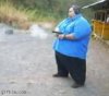 1236337872_fat_guy_shooting_his_gun.jpg