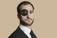 portrait-young-businessman-eye-patch-over-colored-background-29672108.jpg