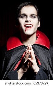 male-vampire-smiling-dangerously-260nw-85378729.jpg