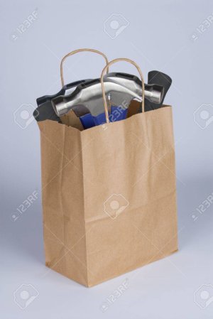 13205397-a-shopping-bag-containing-hammers-to-represent-the-statement-dumber-than-a-bag-of-ham...jpg