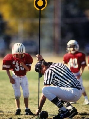 Photographic Print_ Referee Measuring for a First Down During a During a Pee Wee Football _ 2...jpeg