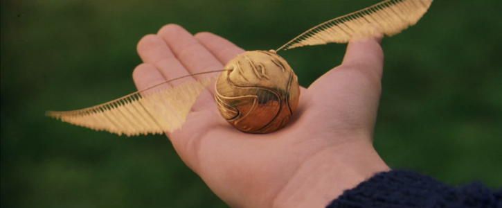 Daniel-Radcliffe-in-Harry-Potter-and-the-Sorcerers-Stone-Golden-Snitch.png