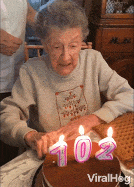 grandma's-fake-teeth-flew-out-when-blowing-a-candle-viralhog.gif