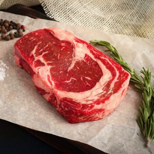 raw-ribeye-steak-lying-on-kraft-shutterstock_741791194.jpg