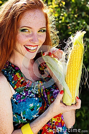 smiling-girl-freckles-holding-corn-cob-portrait-sunny-carroty-hair-appetizing-43135907.jpg