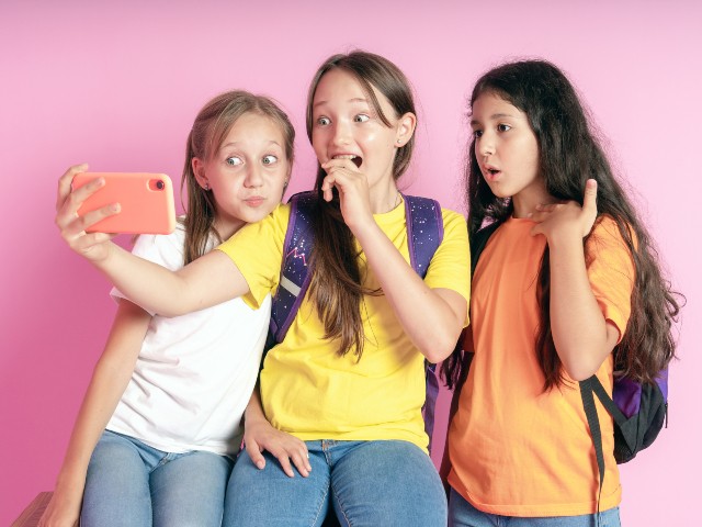 Three-girls-watching-TikTok-videos.jpg