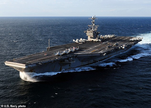 57221061-10769013-At_least_five_crewmembers_aboard_the_USS_George_Washington_pictu-a-5_1651495949784.jpg