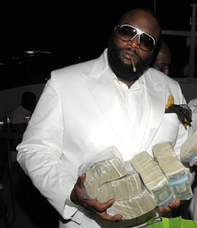 rick-ross-with-money-stacks.jpg