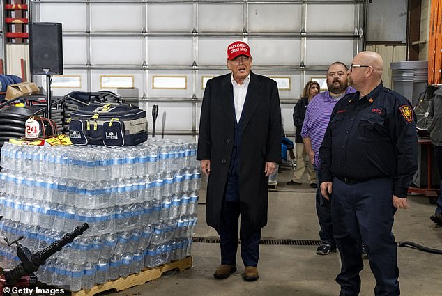 67974157-11781539-Trump_stands_besides_a_pallet_of_his_branded_water_in_East_Pales-a-3_1677101726495.jpg