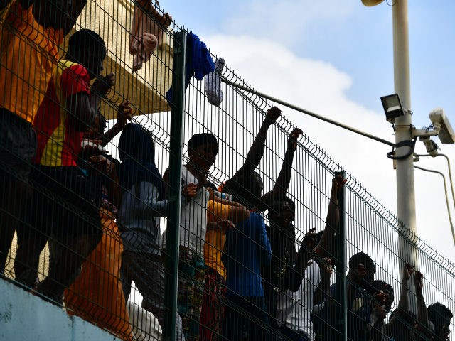 African-migrants-behind-fence-getty-640x480.jpg